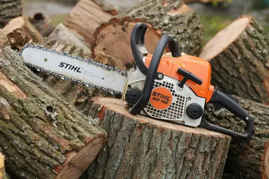 Stihl chainsaw on cut logs